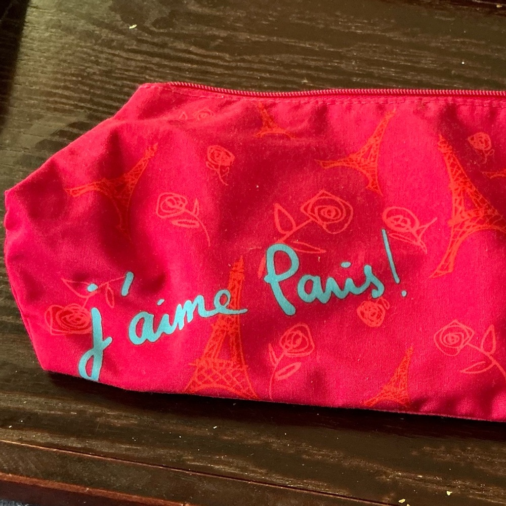 Lancôme pouch, purse or makeup, actually raspberry color with orange pattern